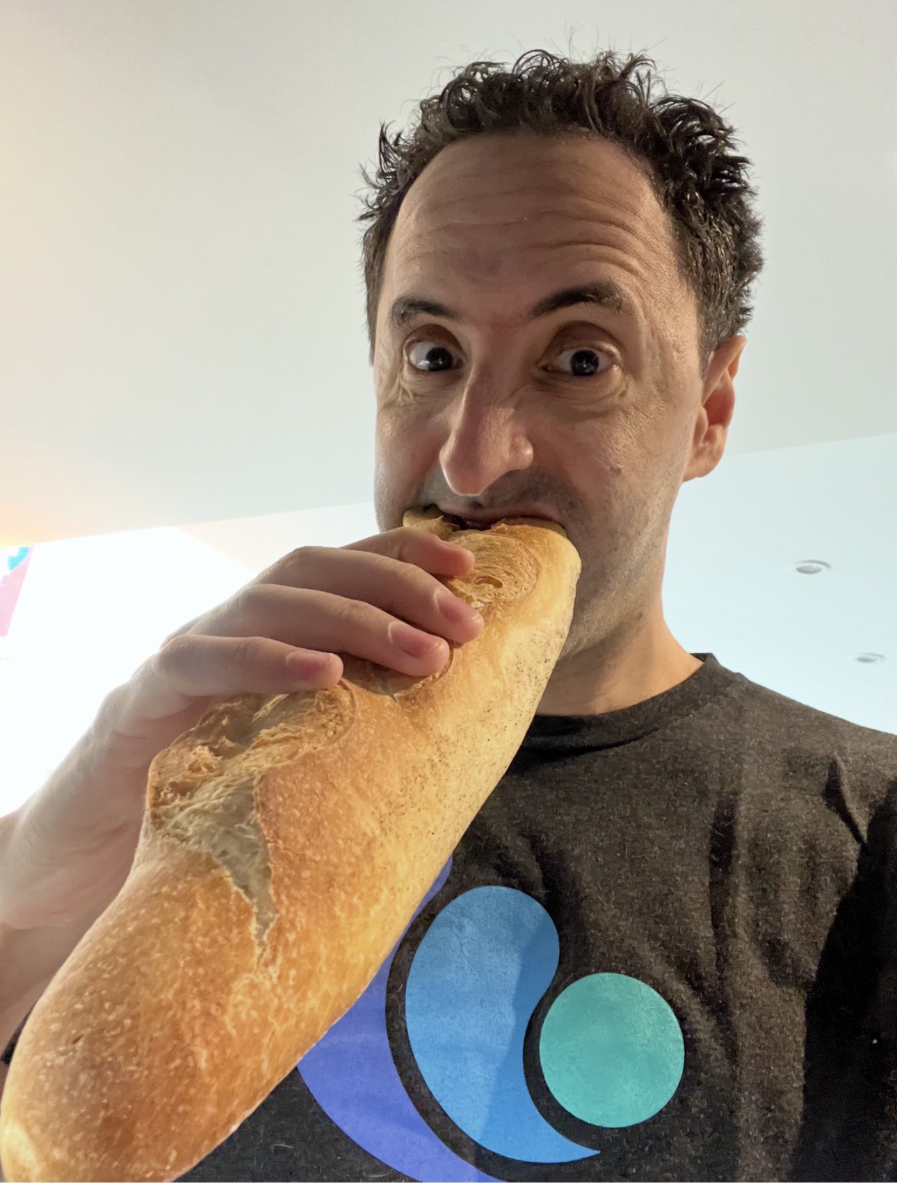David Berkowitz aggressively eating a baguette at Cannes in a previous year